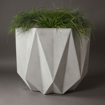 Large concrete planter in a geometric form with faceted edges. modern design for architects and designers